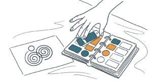 Marker doodle of a hand arranging teal and amber color swatches in a binder beside a logo sketch