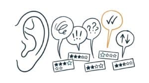 Marker doodle of a large ear turned toward speech bubbles rising from a scatter of star-rating cards